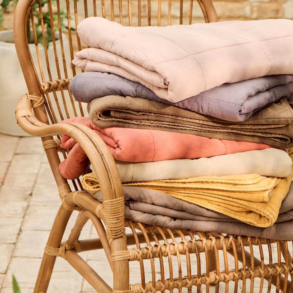 stack of folded cotton vintage  quilts Ib laursen