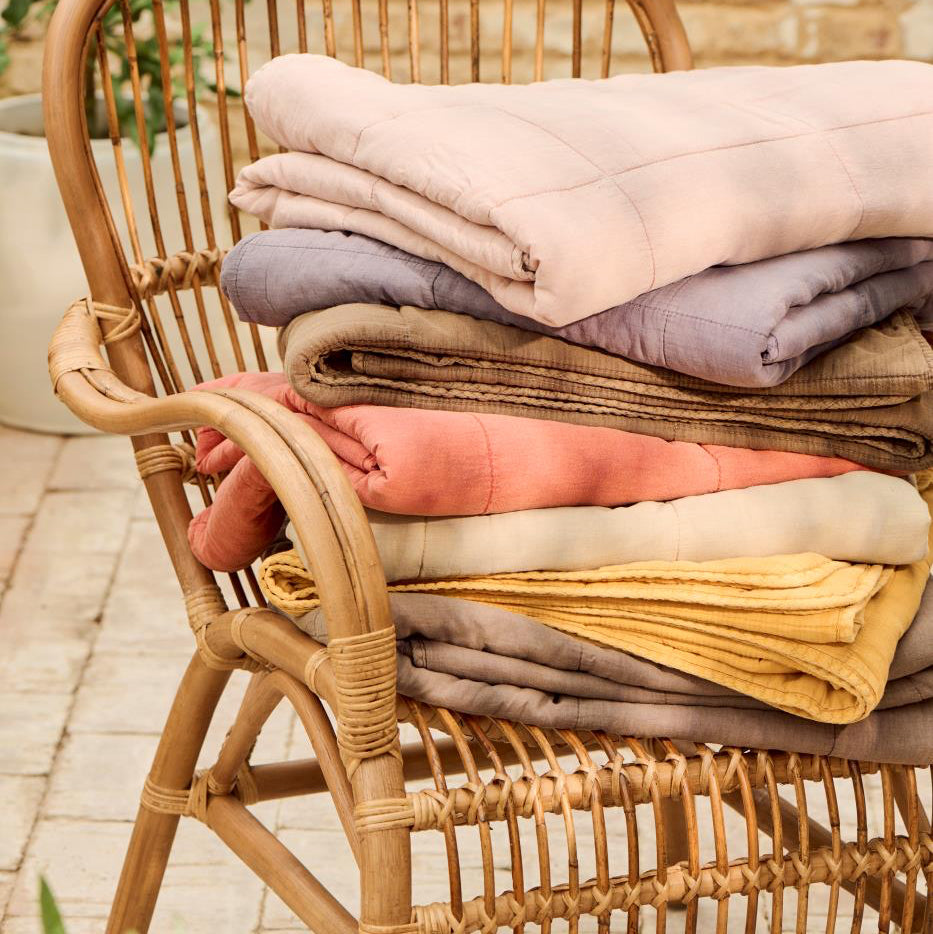 stack of folded cotton vintage  quilts Ib laursen