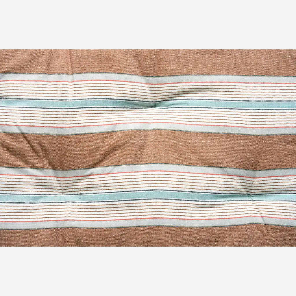Striped mattress cushion with brown, blue, and red lines 