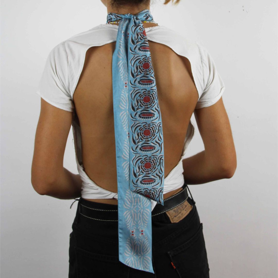 Les Belles Vagabondes Silk Twilly Camelia Blue Shown Wearing as a Scarf Fashion Statement