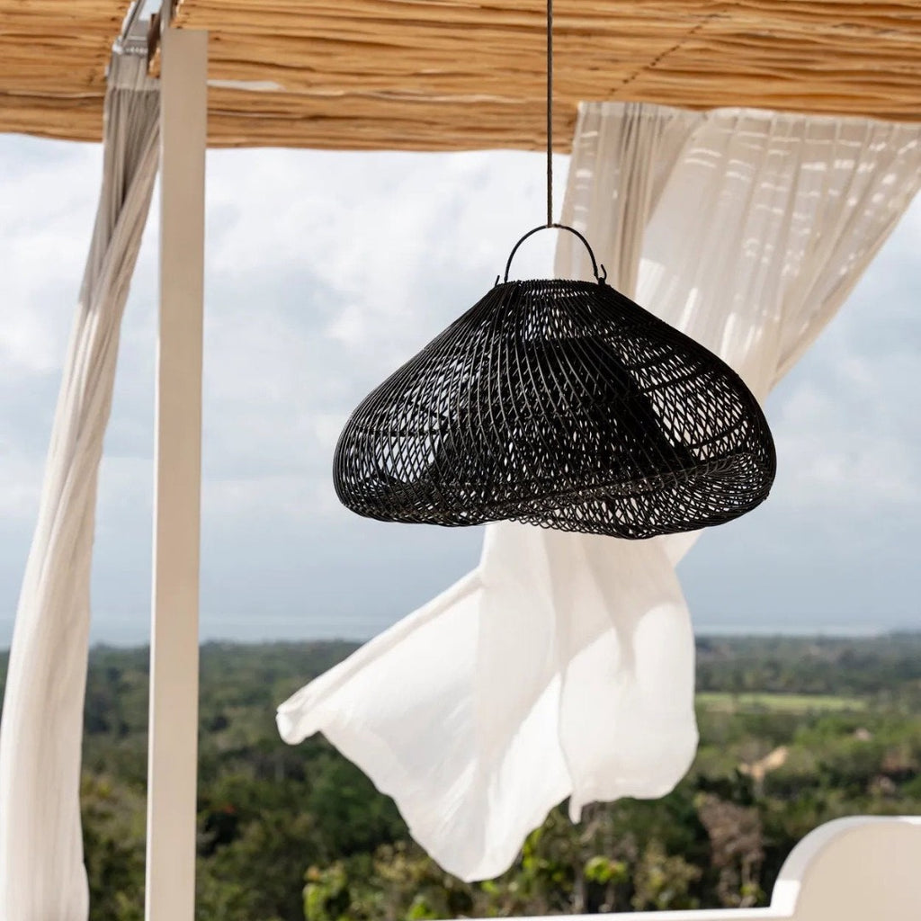 Black woven pendant light hanging from a wooden canopy 