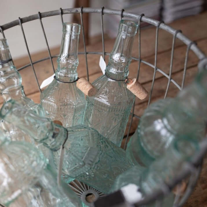 wire basket laundry storage metal baskets Van Verre fair-trade glass bottles